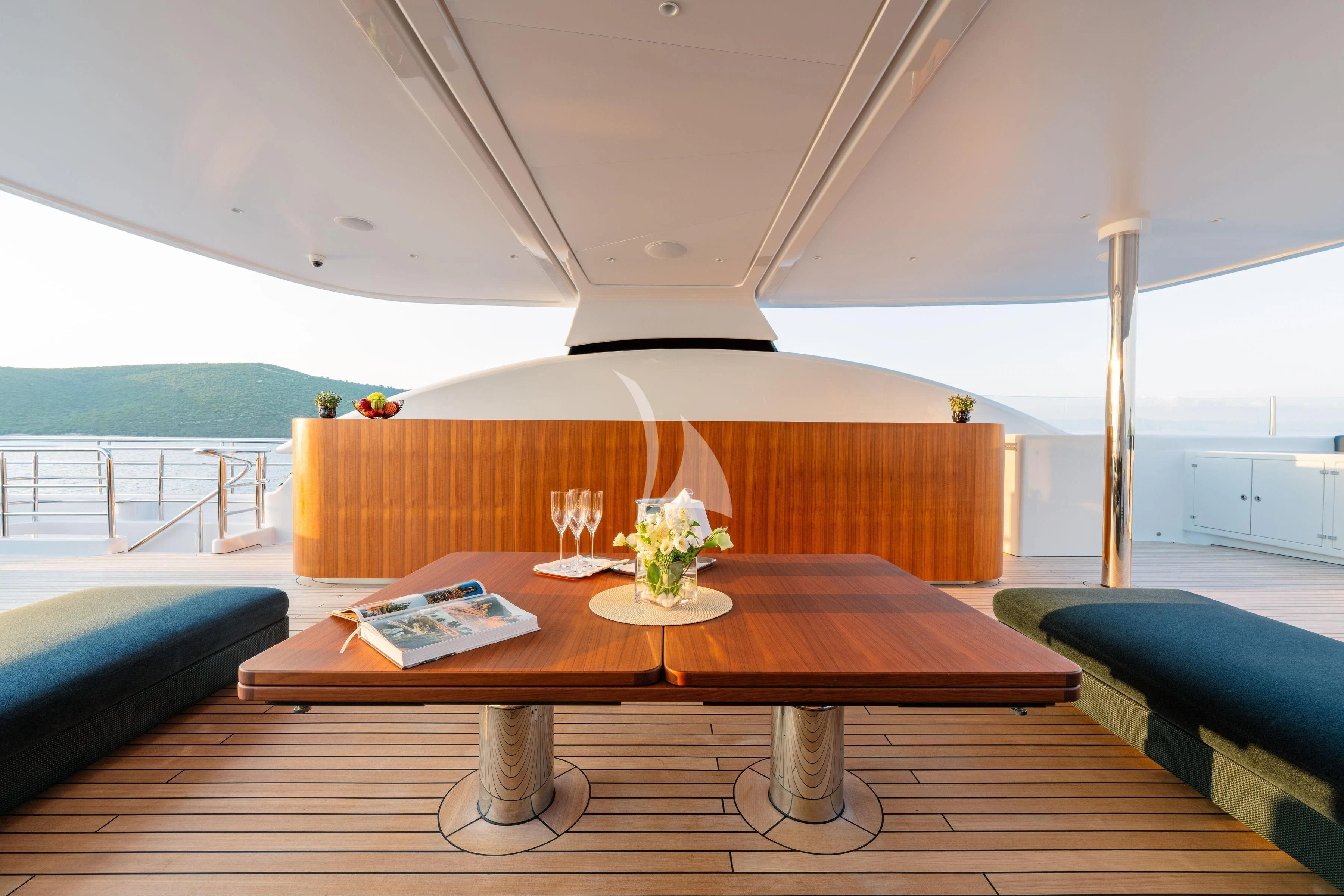 a table with a flower on it aboard TIREA Yacht for Sale