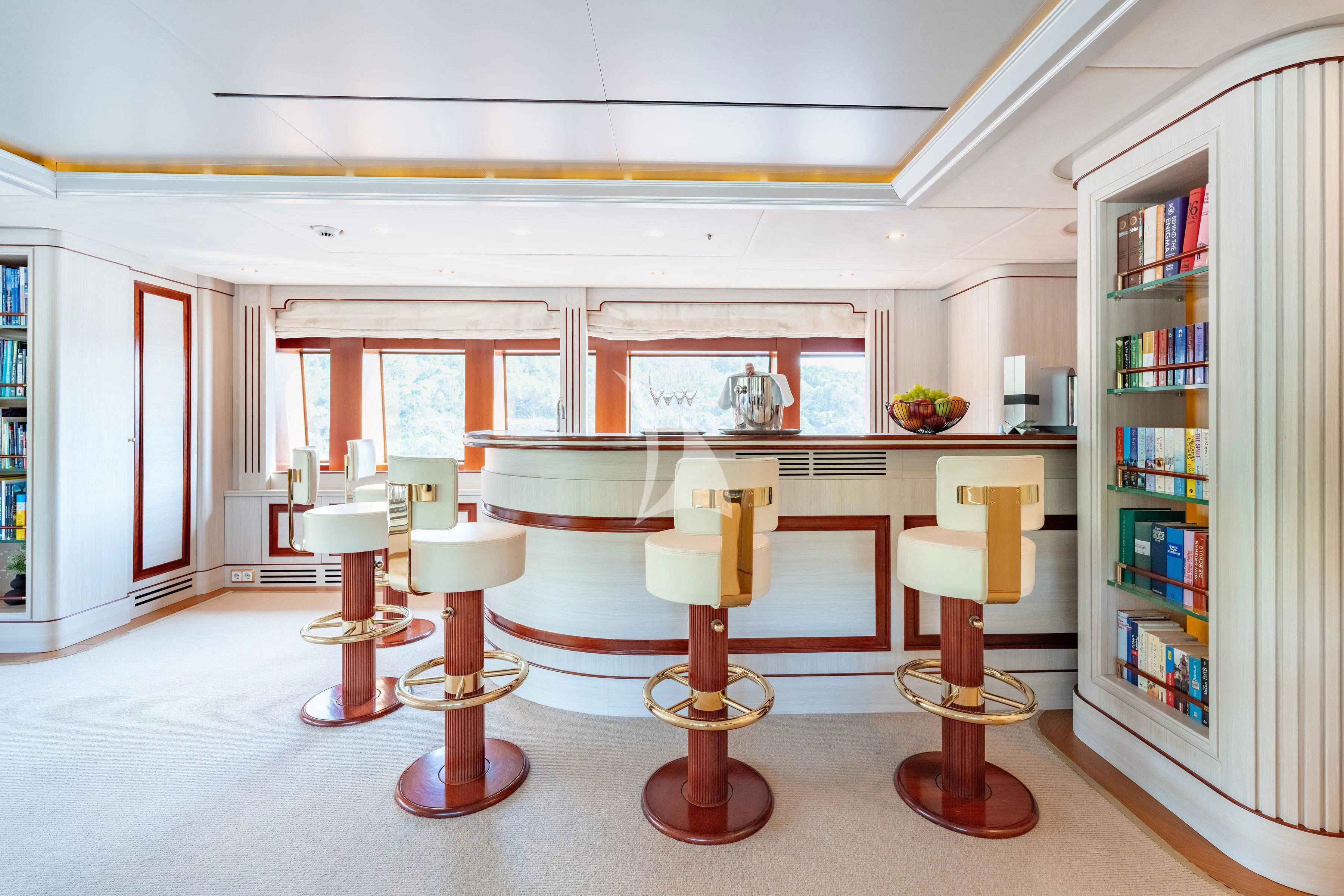 a room with a table and chairs aboard TIREA Yacht for Sale