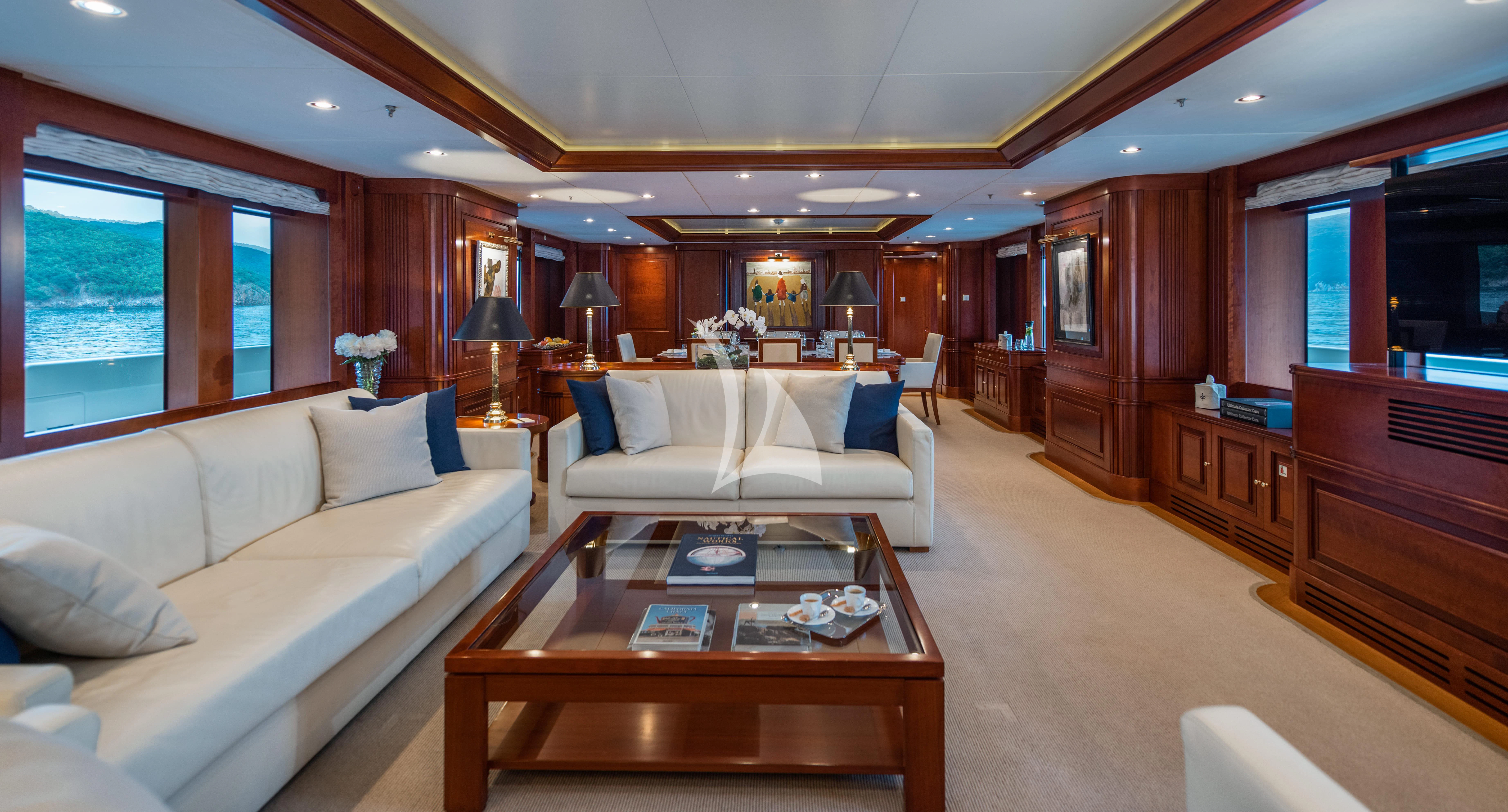 a living room with a couch and a coffee table aboard TIREA Yacht for Sale