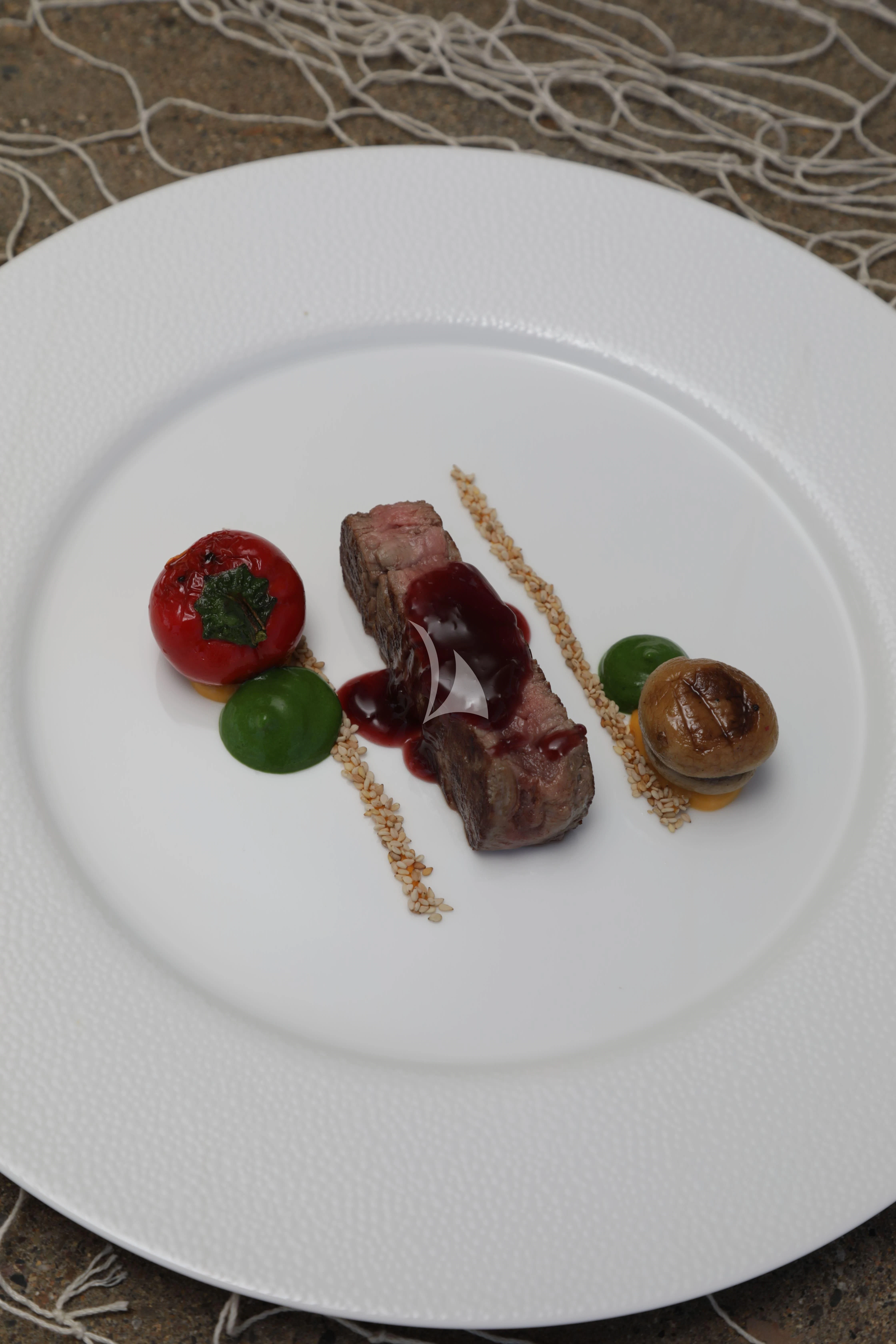 a plate of food aboard TIREA Yacht for Sale