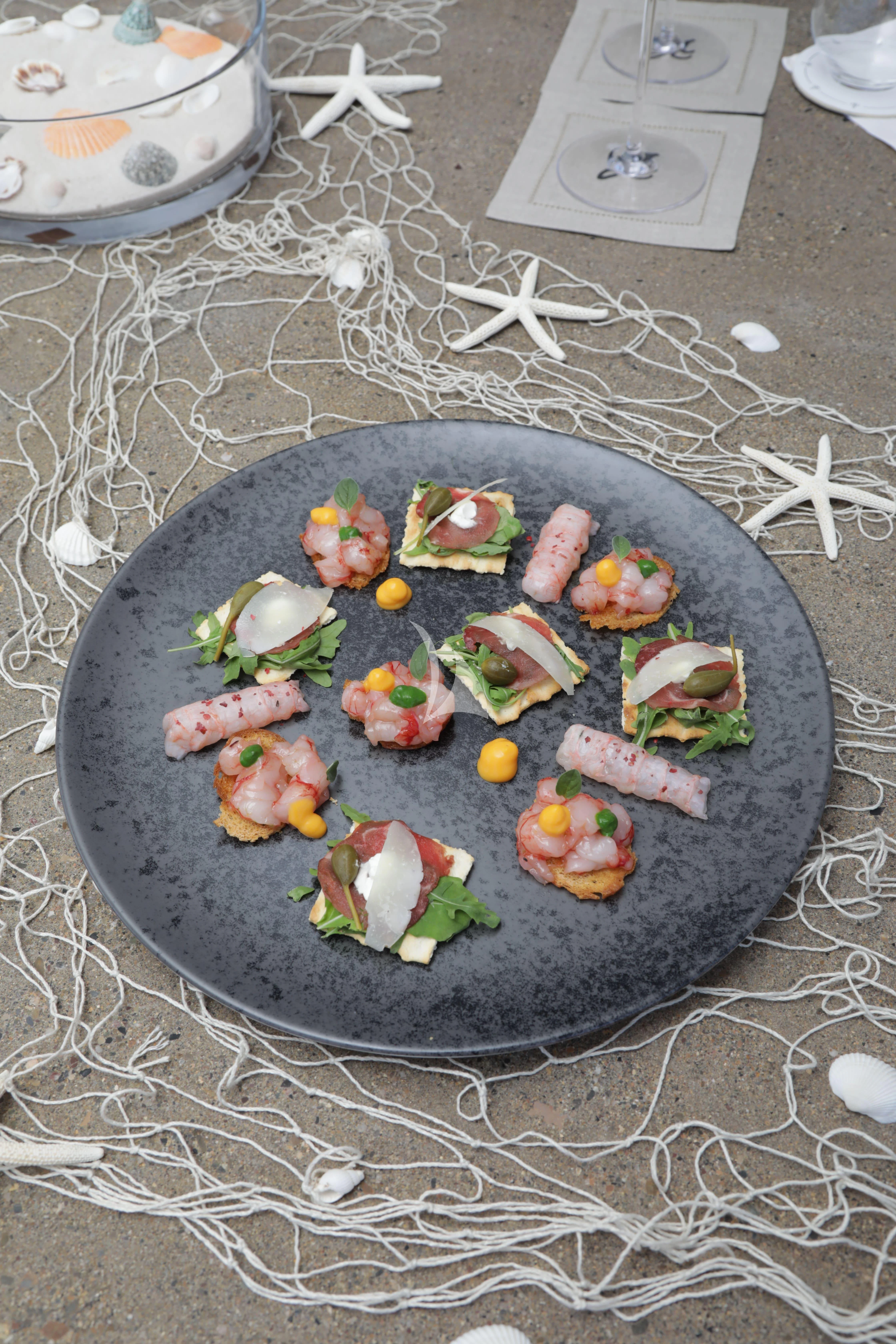 a plate of sushi aboard TIREA Yacht for Sale
