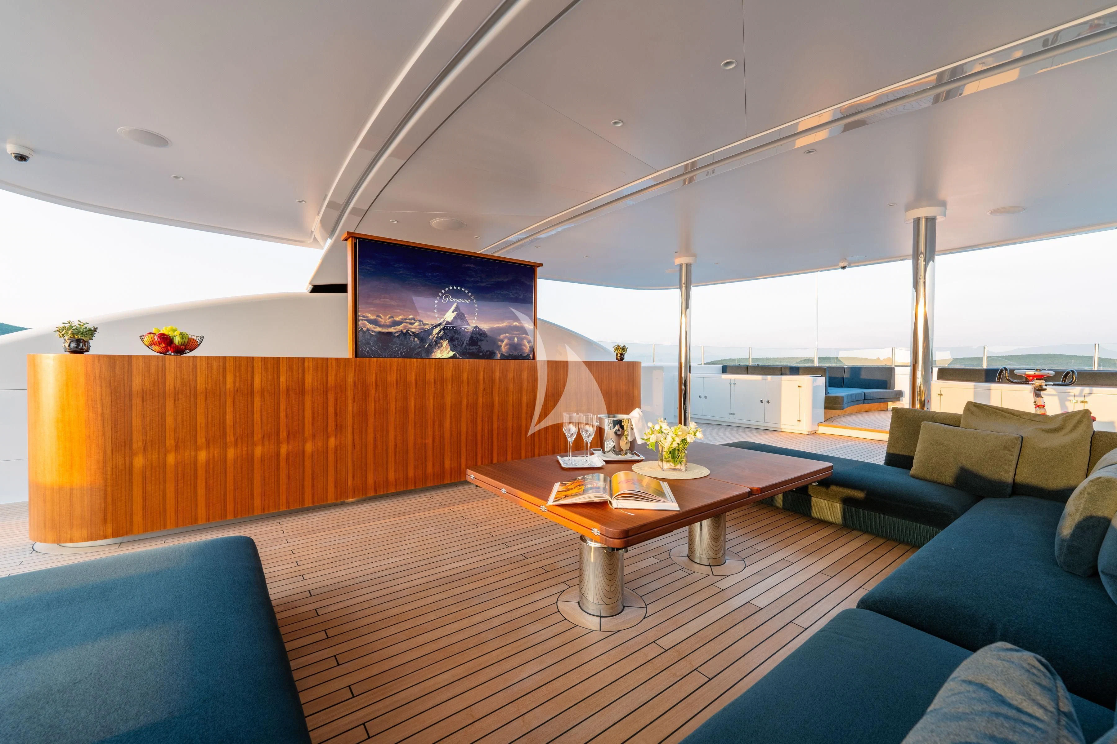 a room with a table and couches aboard TIREA Yacht for Sale