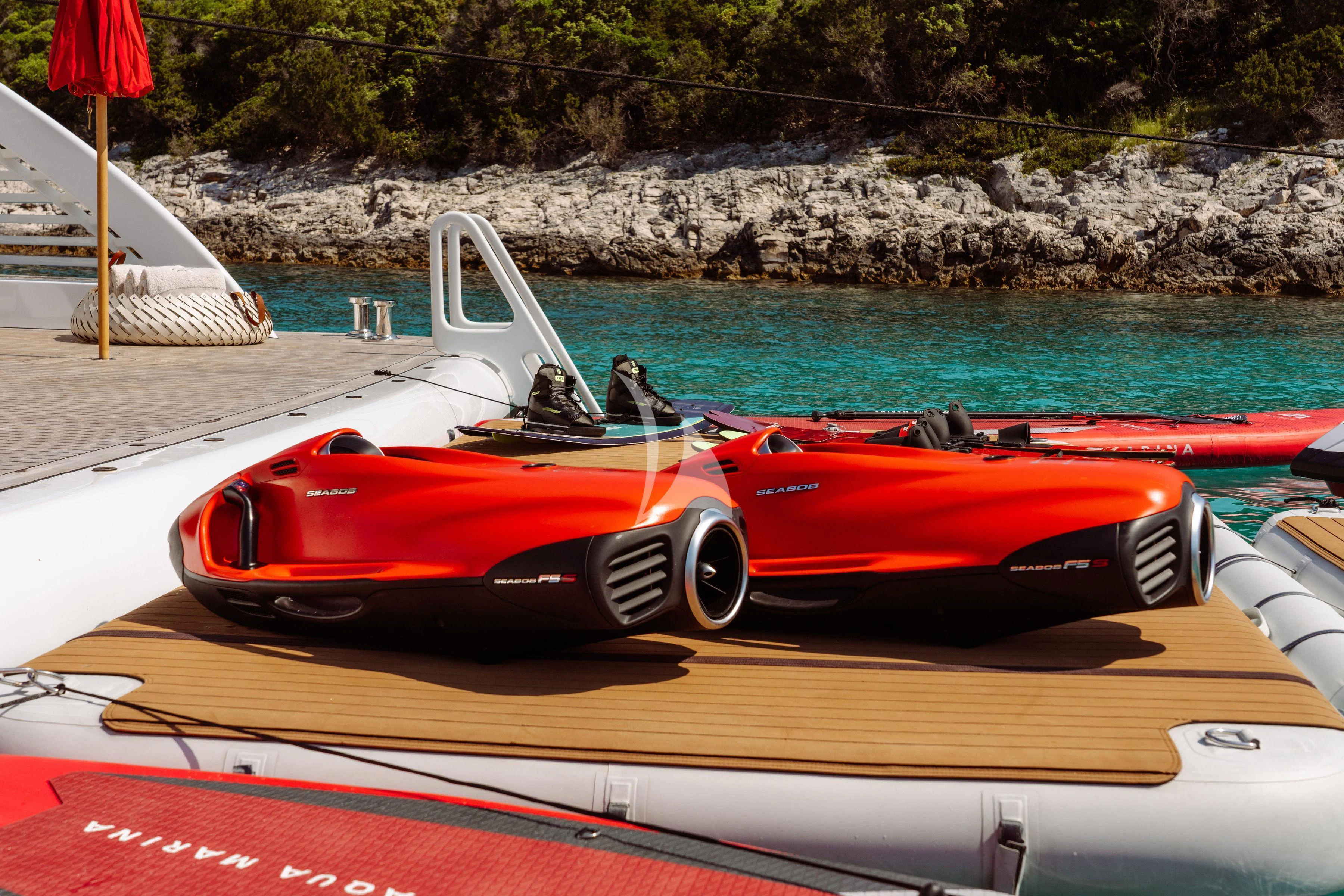 a red and white sports car on a boat aboard TIREA Yacht for Sale