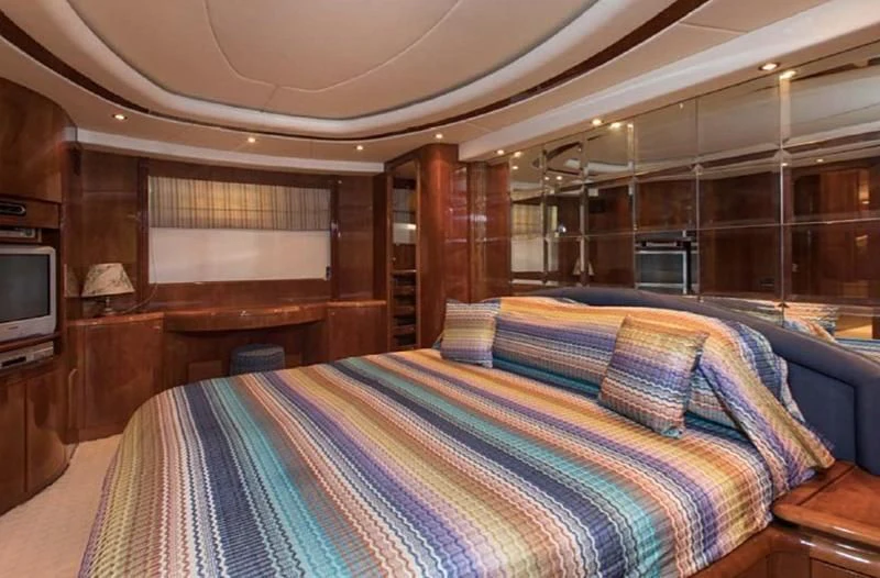 a bed in a room aboard TITAN Yacht for Sale