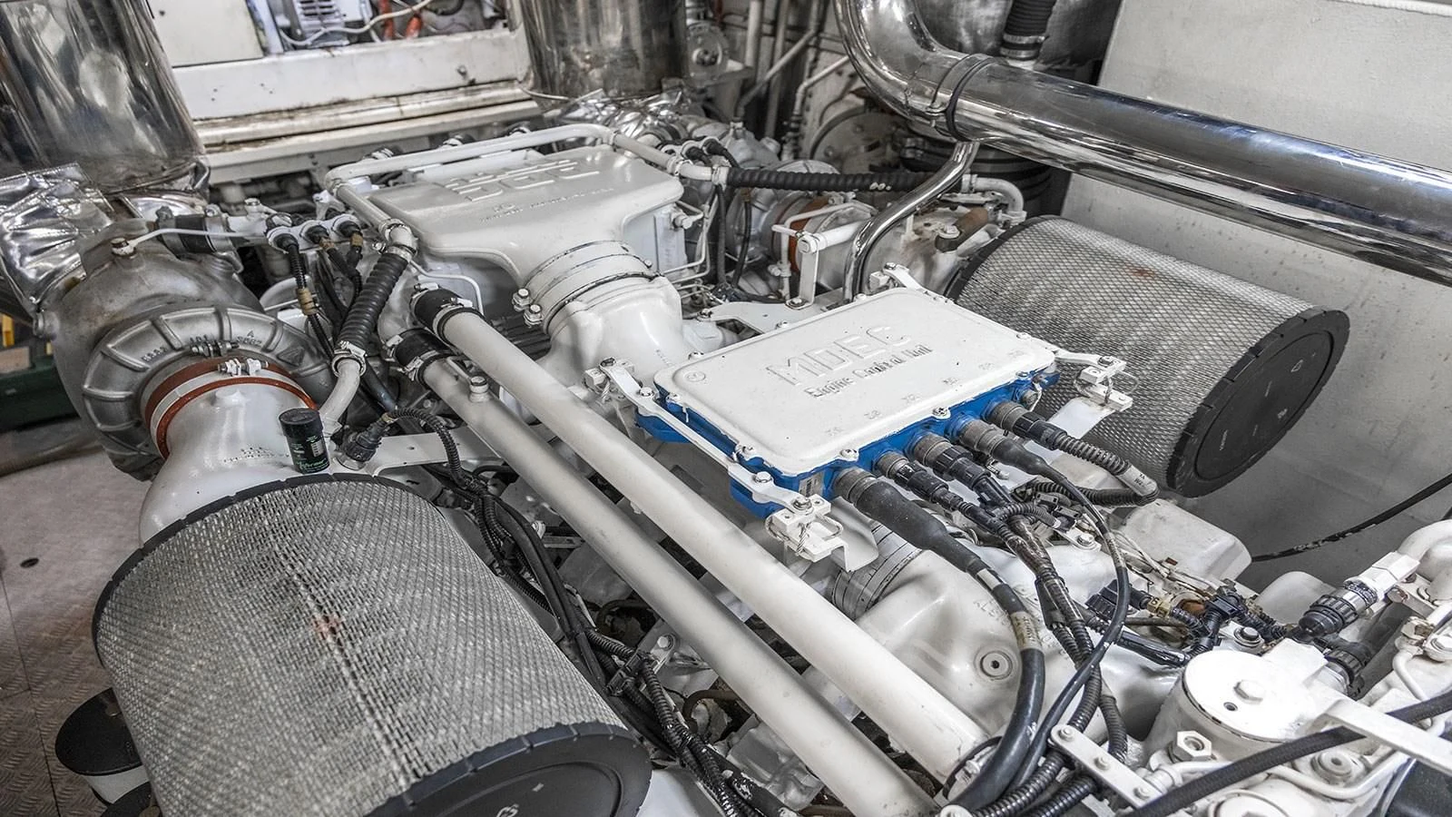 a car engine with a car hood aboard TITAN Yacht for Sale