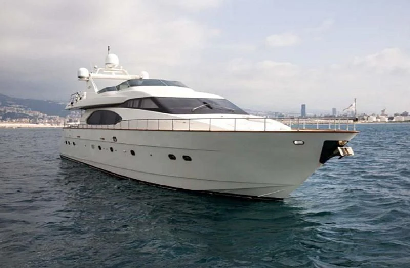 a white yacht in the water aboard TITAN Yacht for Sale