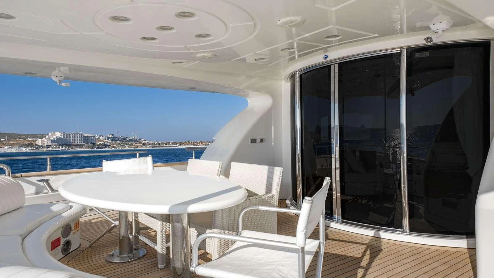a room with a table and chairs aboard TITAN Yacht for Sale