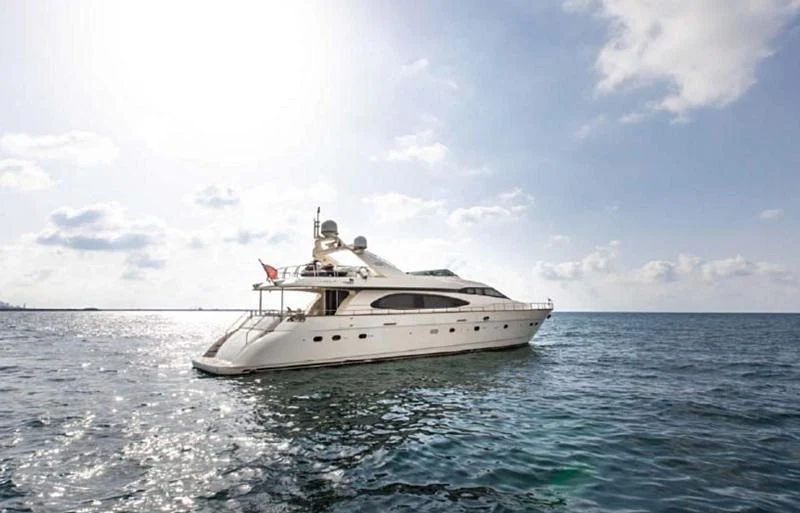 a white boat in the water aboard TITAN Yacht for Sale