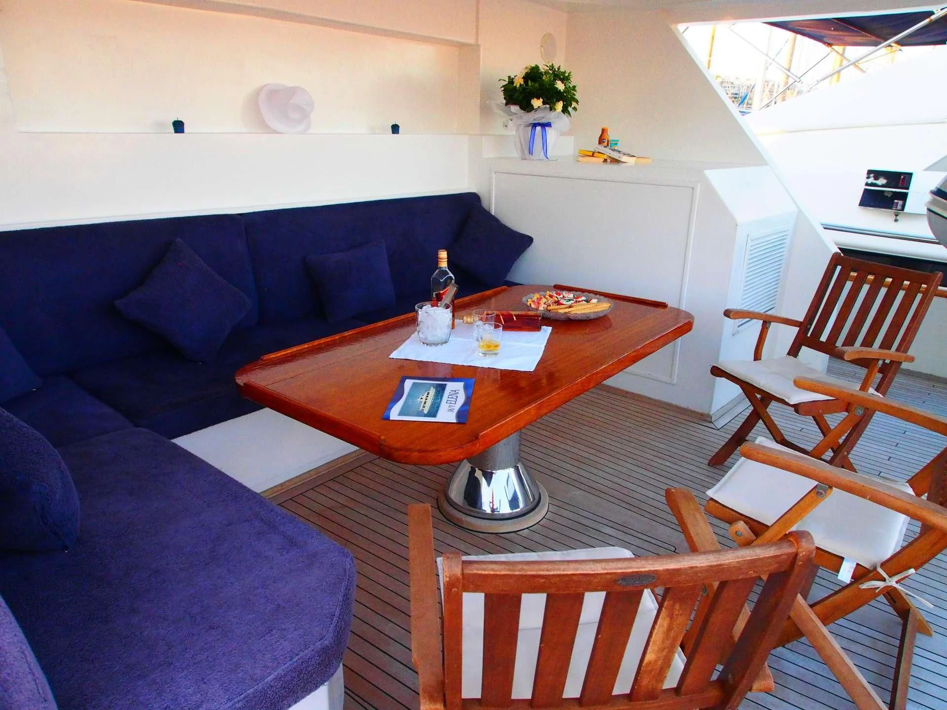 a table and chairs in a room aboard K Yacht for Sale