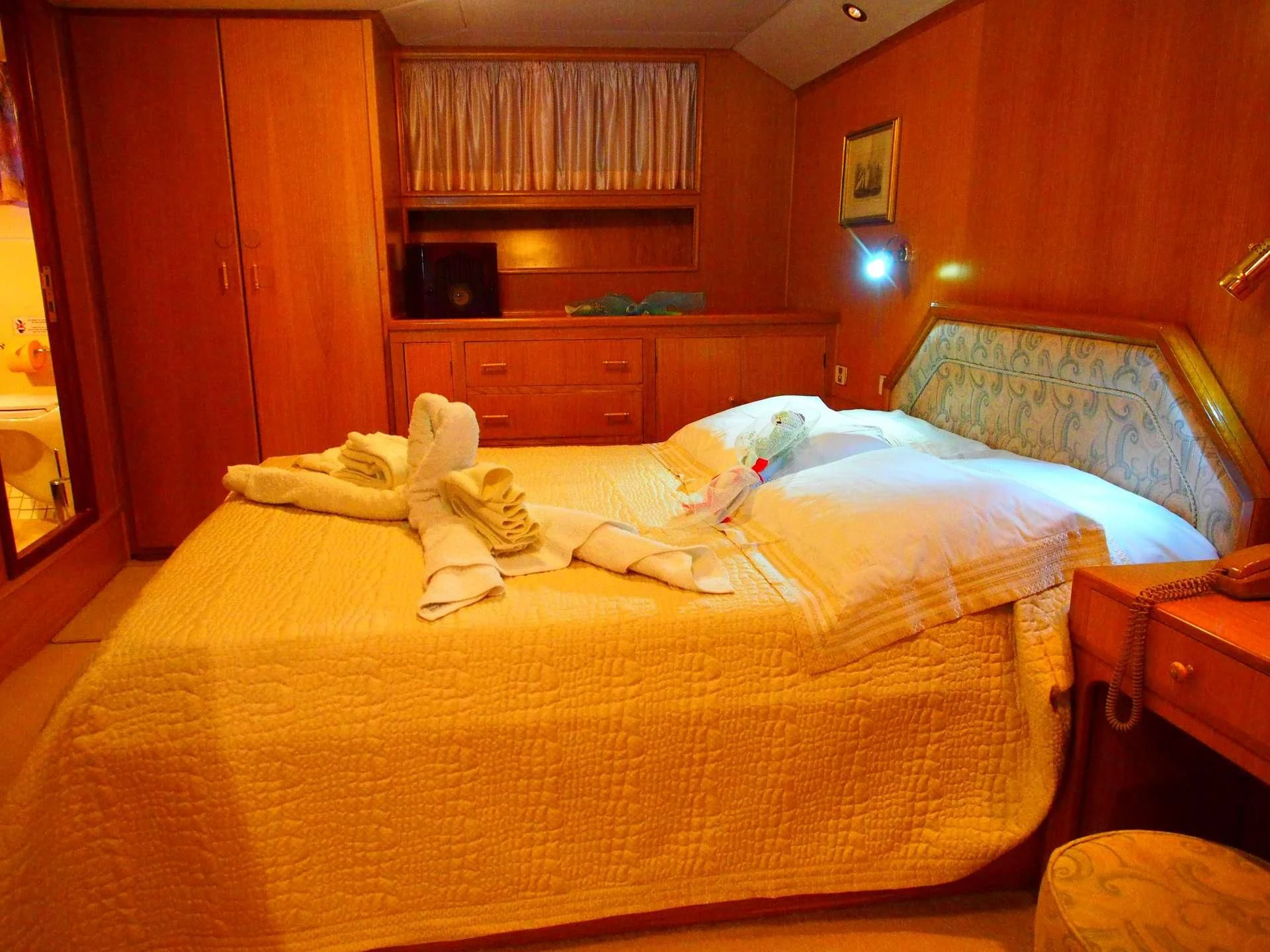 a group of dolls on a bed aboard K Yacht for Sale