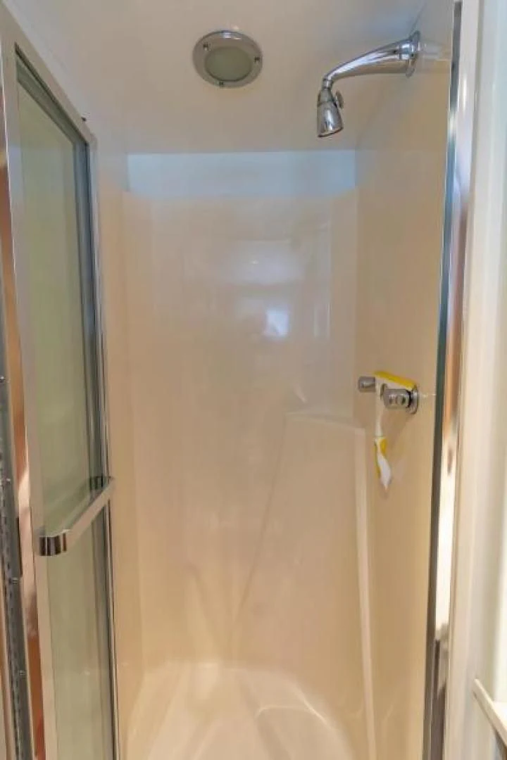 a shower with a door aboard K Yacht for Sale
