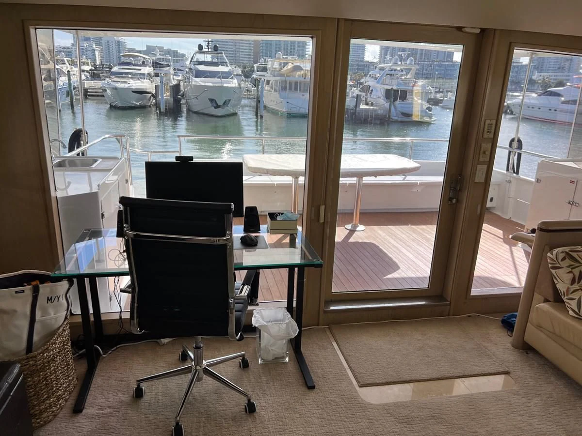 a room with a table and chairs aboard K Yacht for Sale