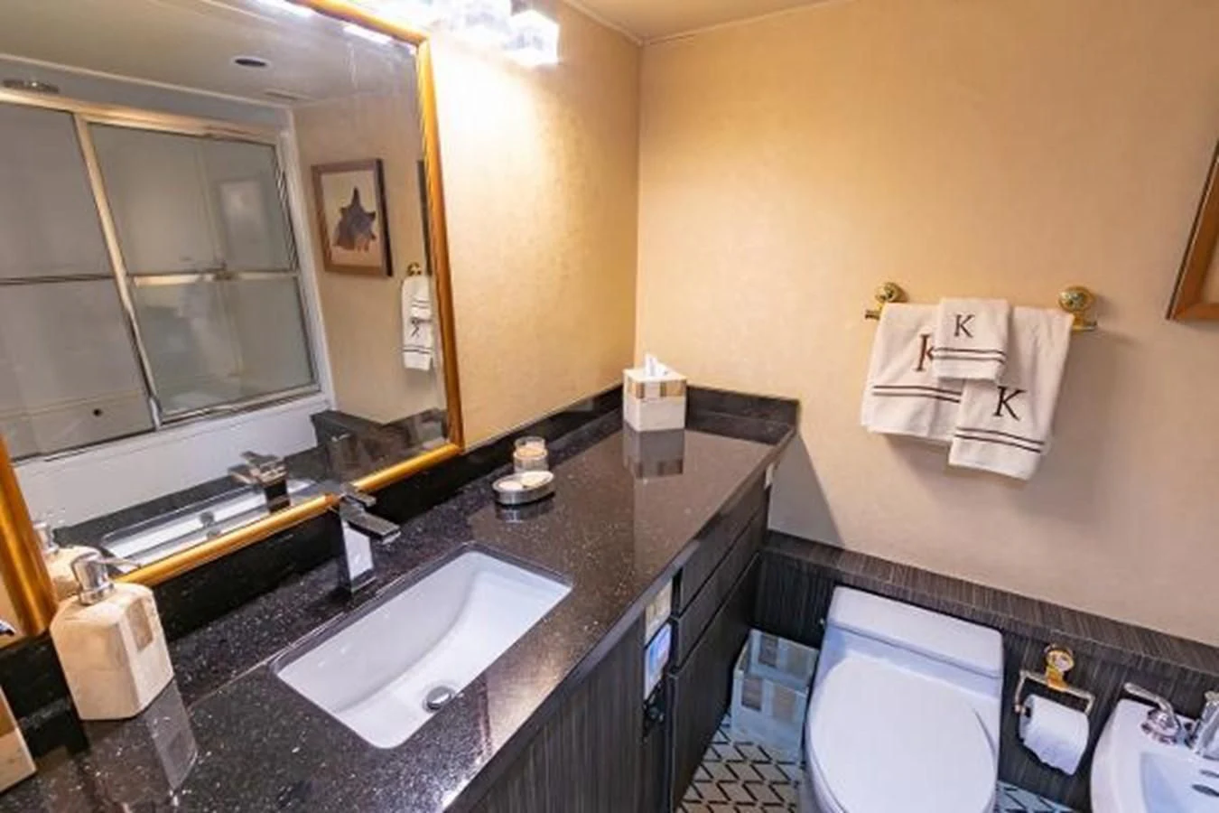a bathroom with a sink and a mirror aboard K Yacht for Sale