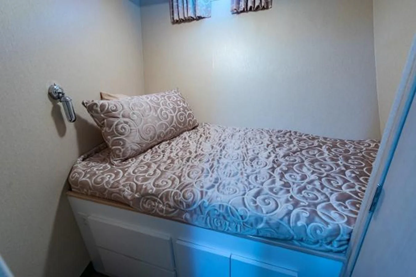 a bed with a pillow aboard K Yacht for Sale