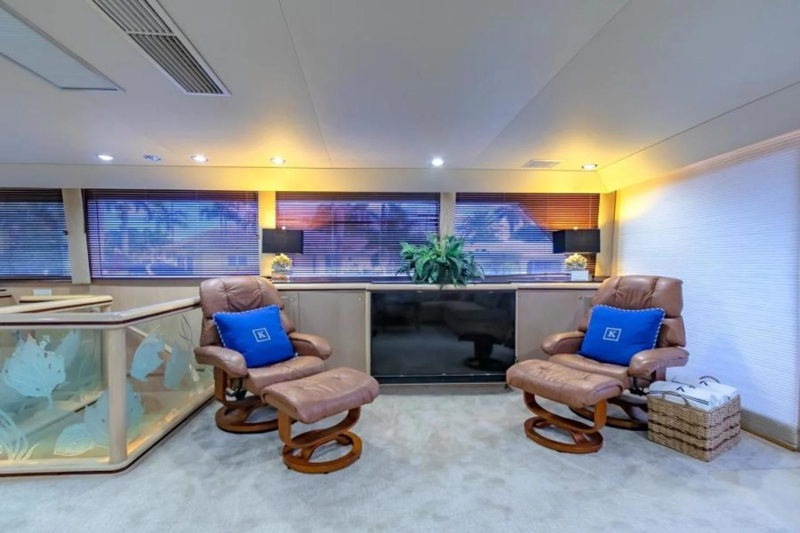 a living room with a fireplace aboard K Yacht for Sale