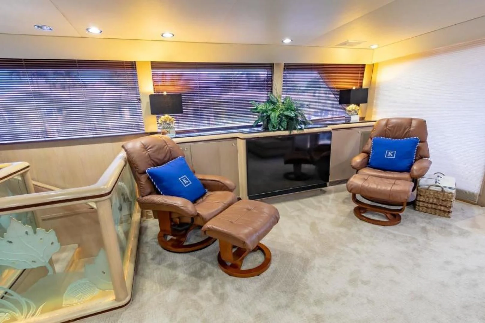a room with a table chairs and a tv aboard K Yacht for Sale