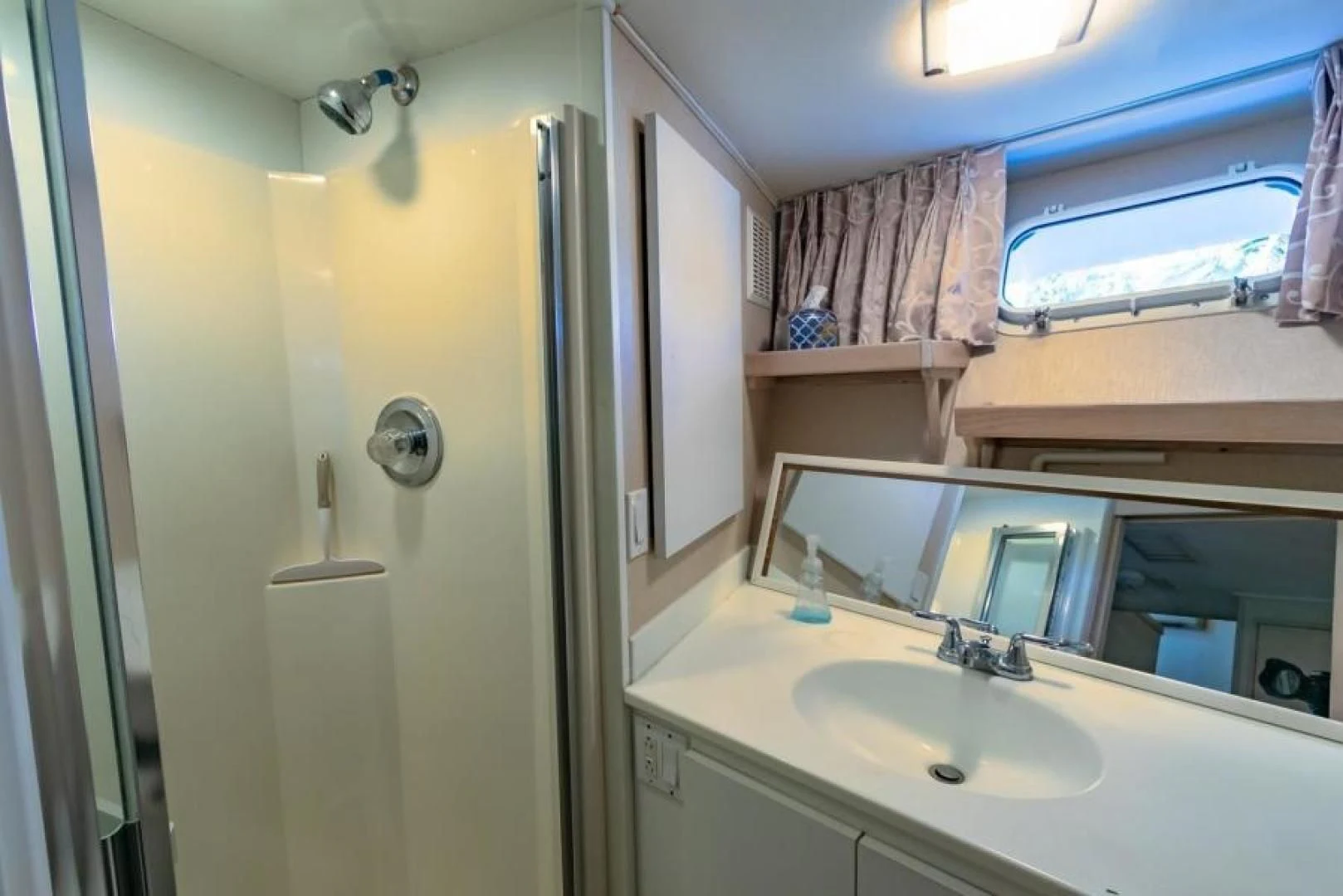 a bathroom with a sink and a mirror aboard K Yacht for Sale