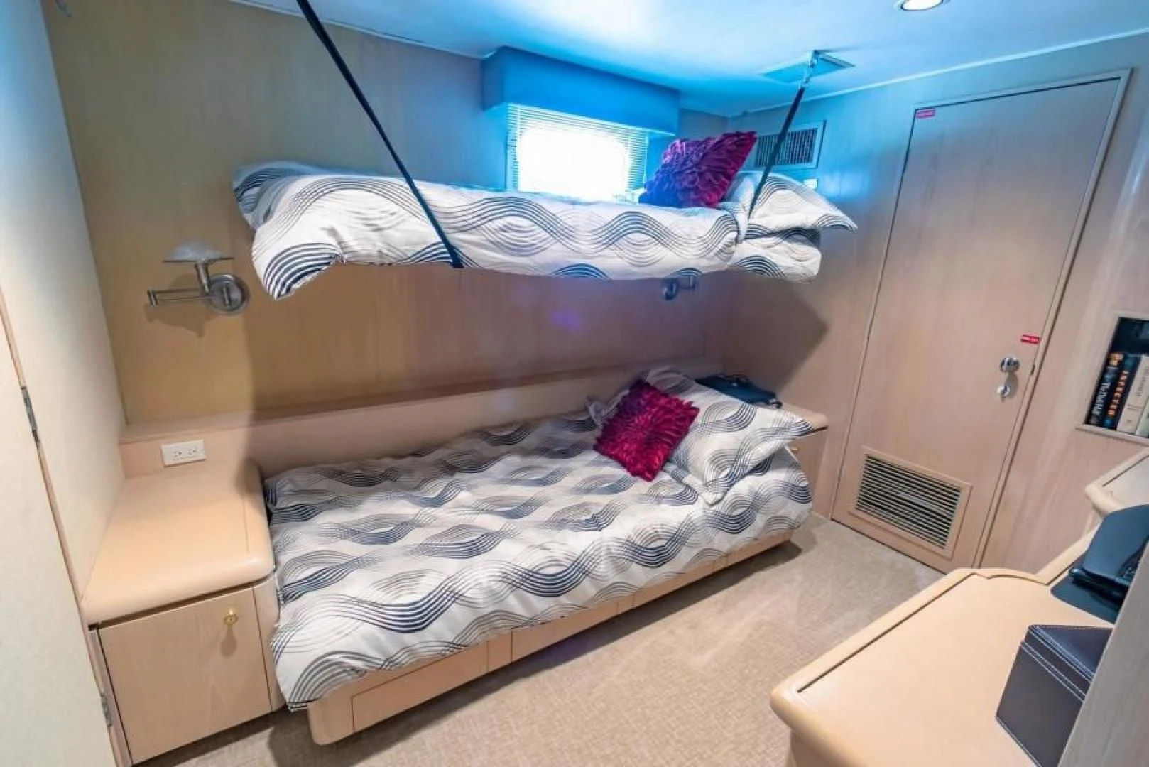 a couple of beds in a room aboard K Yacht for Sale