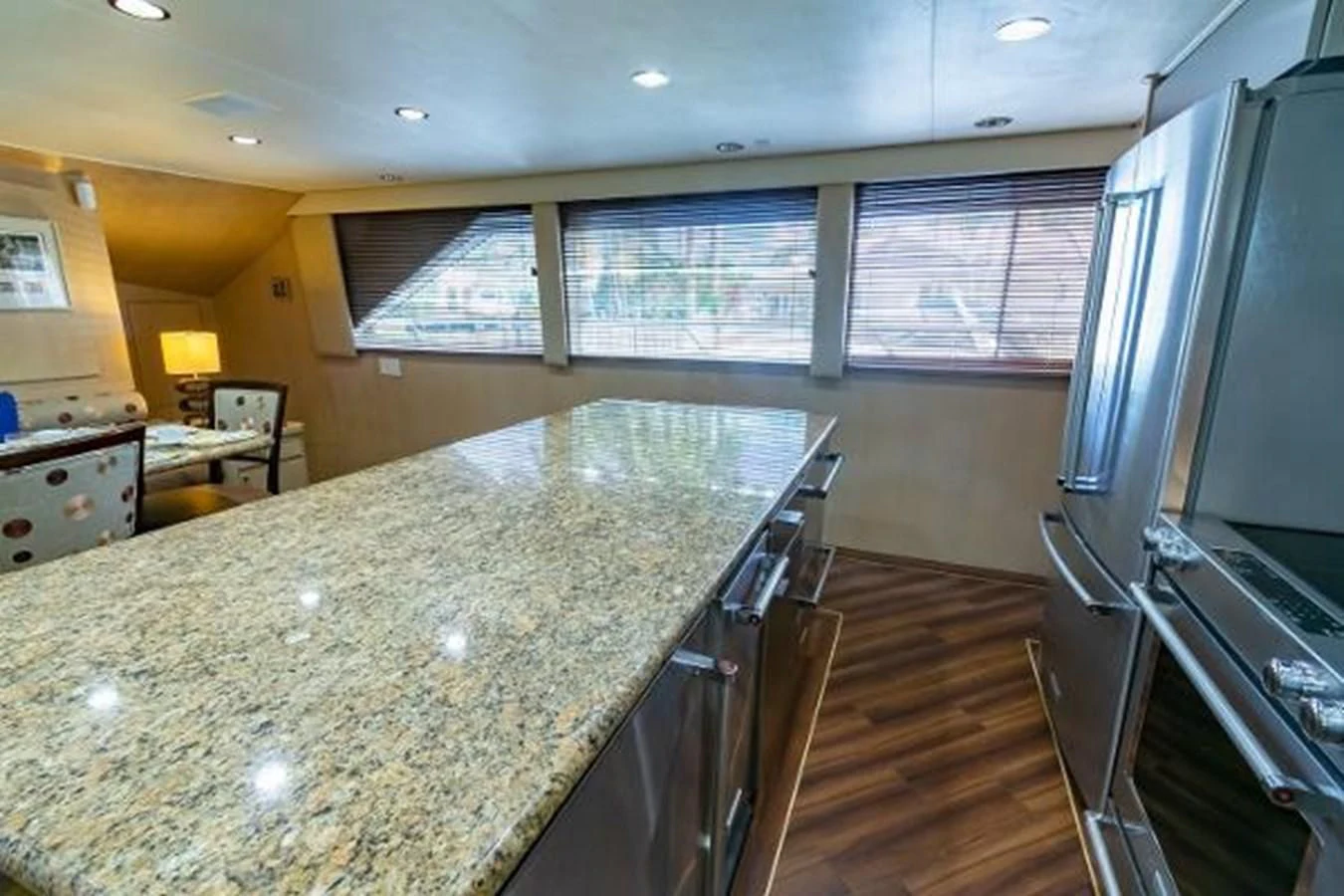 a large kitchen with stainless steel appliances aboard K Yacht for Sale
