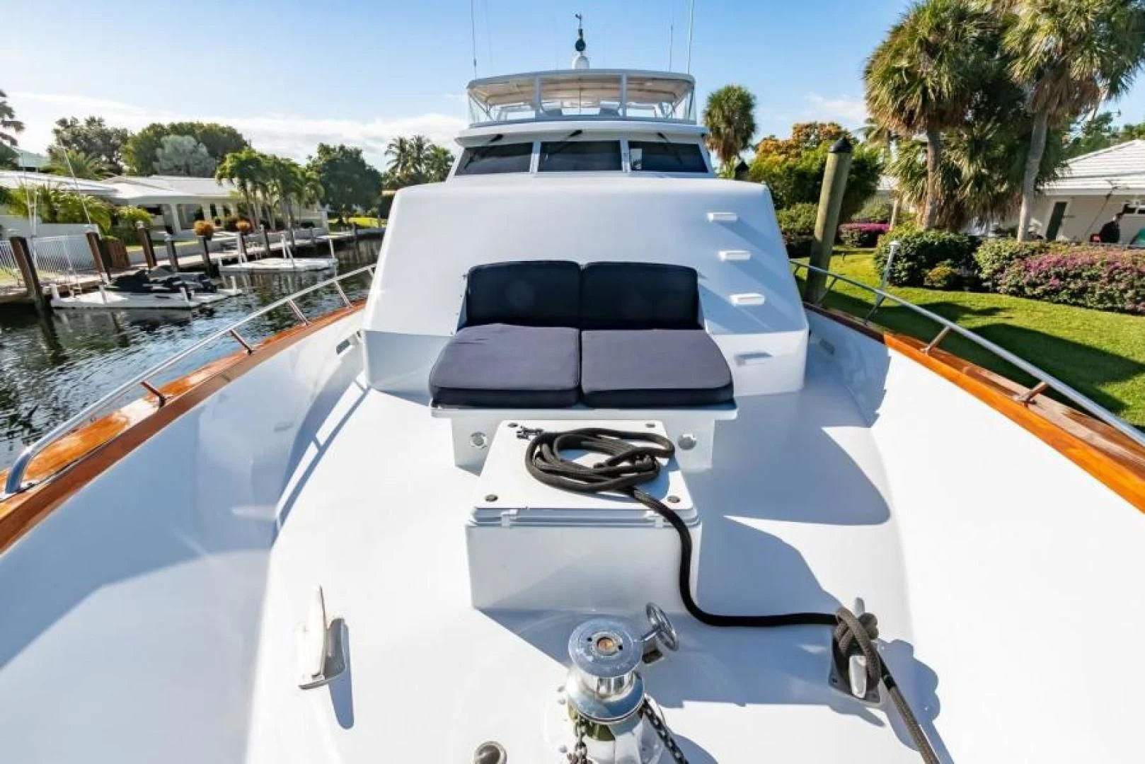 a white yacht with a black seat aboard K Yacht for Sale