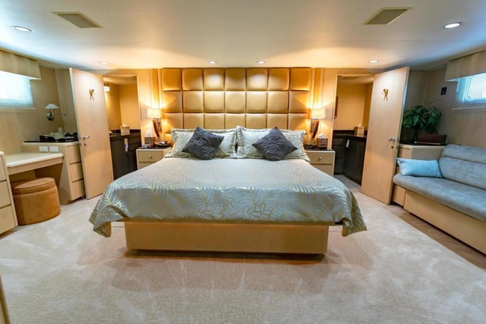 a large bed in a hotel room aboard K Yacht for Sale