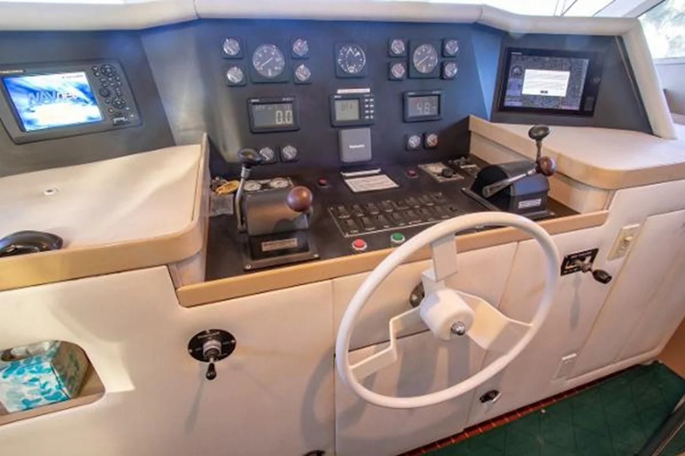 a plane cockpit with a computer and a keyboard aboard K Yacht for Sale