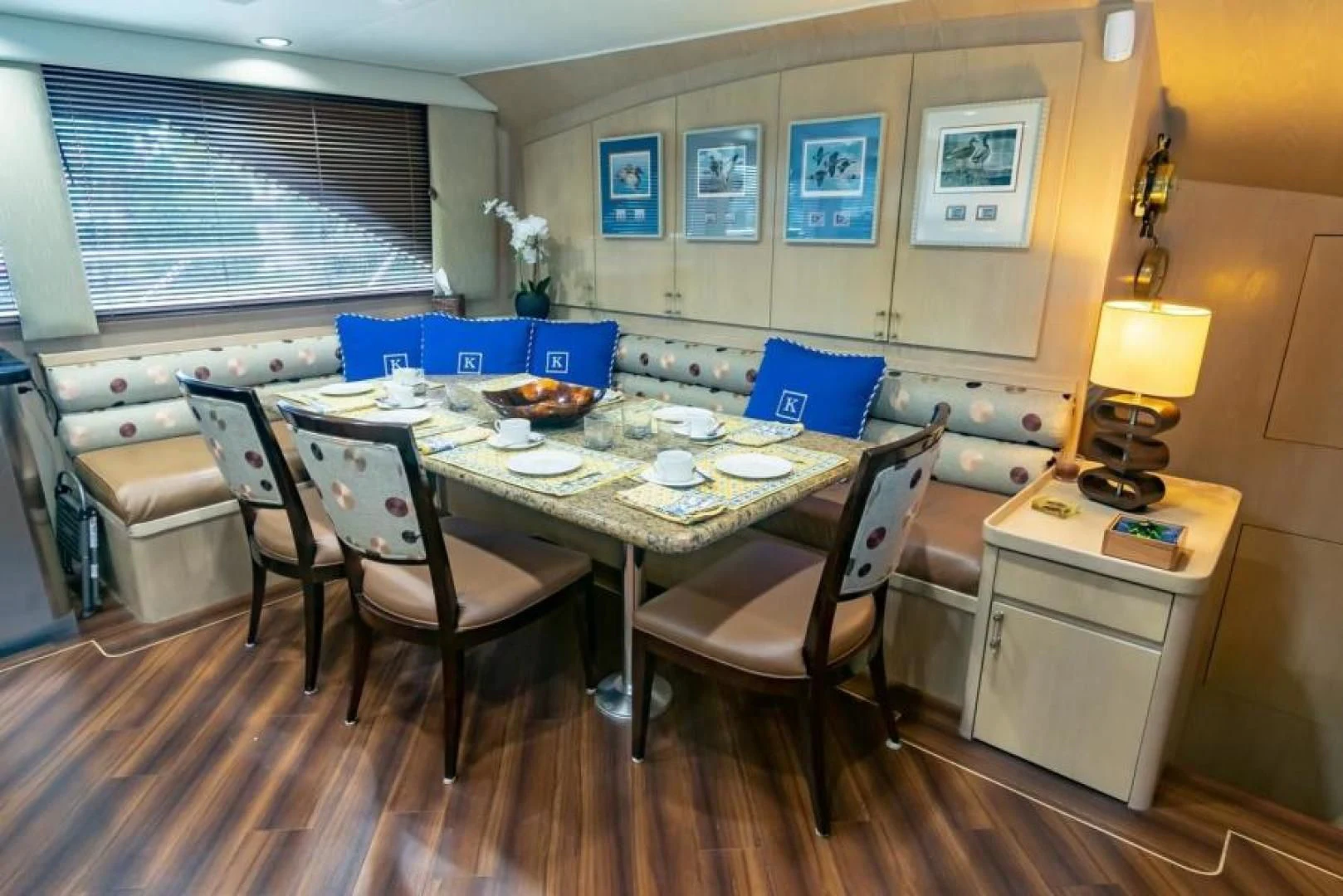 a kitchen with a table and chairs aboard K Yacht for Sale