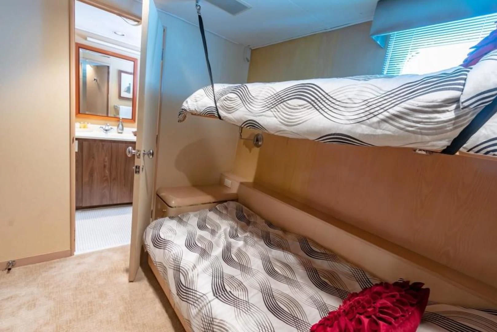 a bedroom with a bunk bed aboard K Yacht for Sale