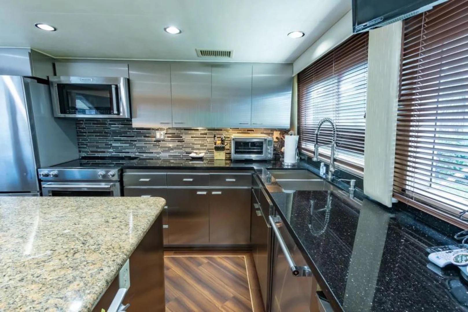 a kitchen with a large island aboard K Yacht for Sale