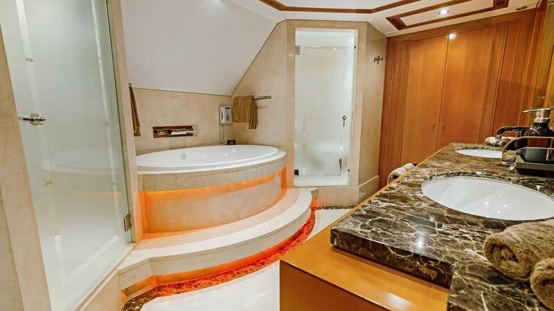 a bathroom with a marble countertop aboard PLEIADES II Yacht for Sale