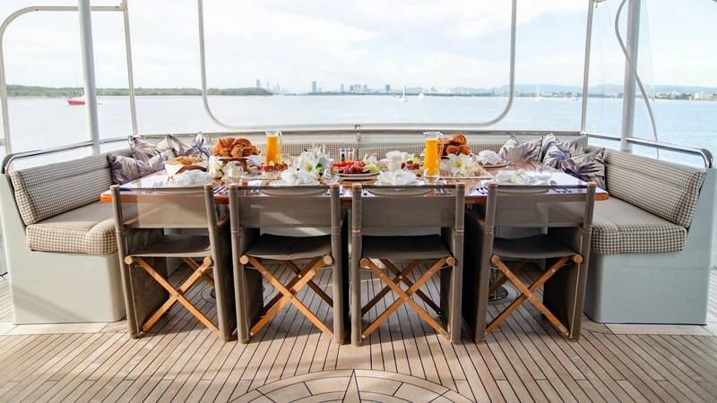 a table set for a dinner aboard PLEIADES II Yacht for Sale