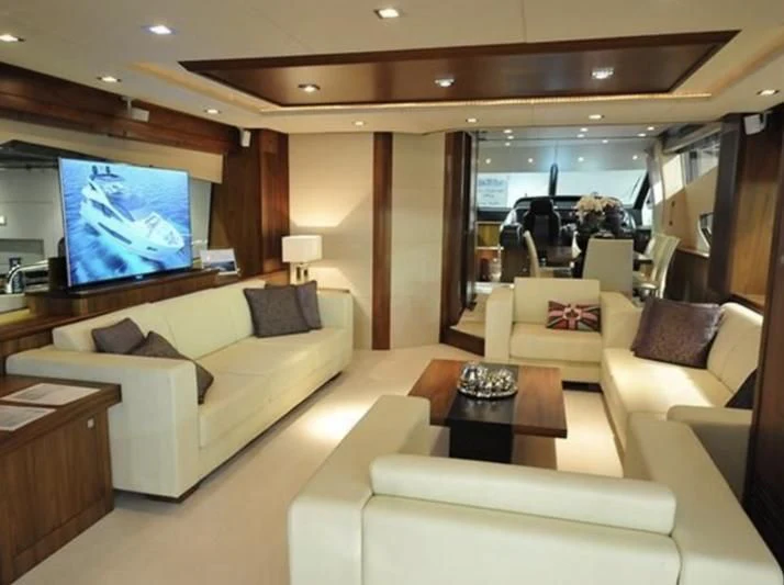 a living room with a large screen aboard FAMILY SPIRIT Yacht for Sale