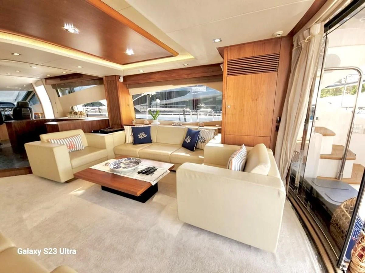 a living room with a couch and a table aboard FAMILY SPIRIT Yacht for Sale