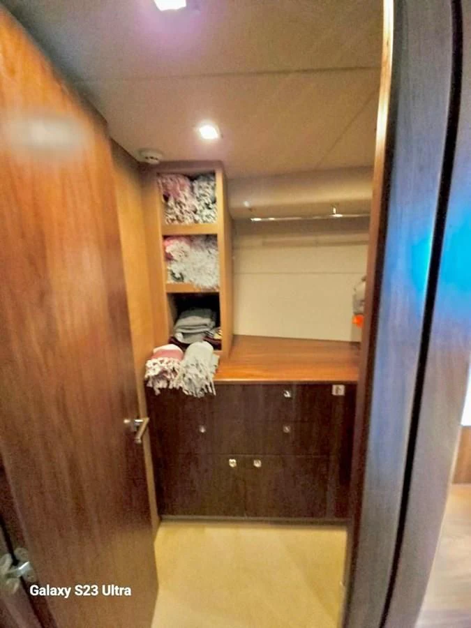 a room with a closet and a door aboard FAMILY SPIRIT Yacht for Sale