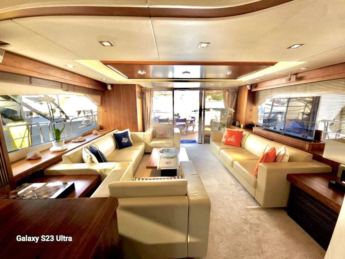 a living room with a large window aboard FAMILY SPIRIT Yacht for Sale