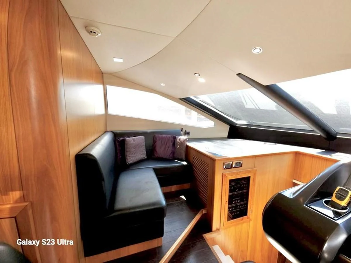 a room with a couch and a desk aboard FAMILY SPIRIT Yacht for Sale