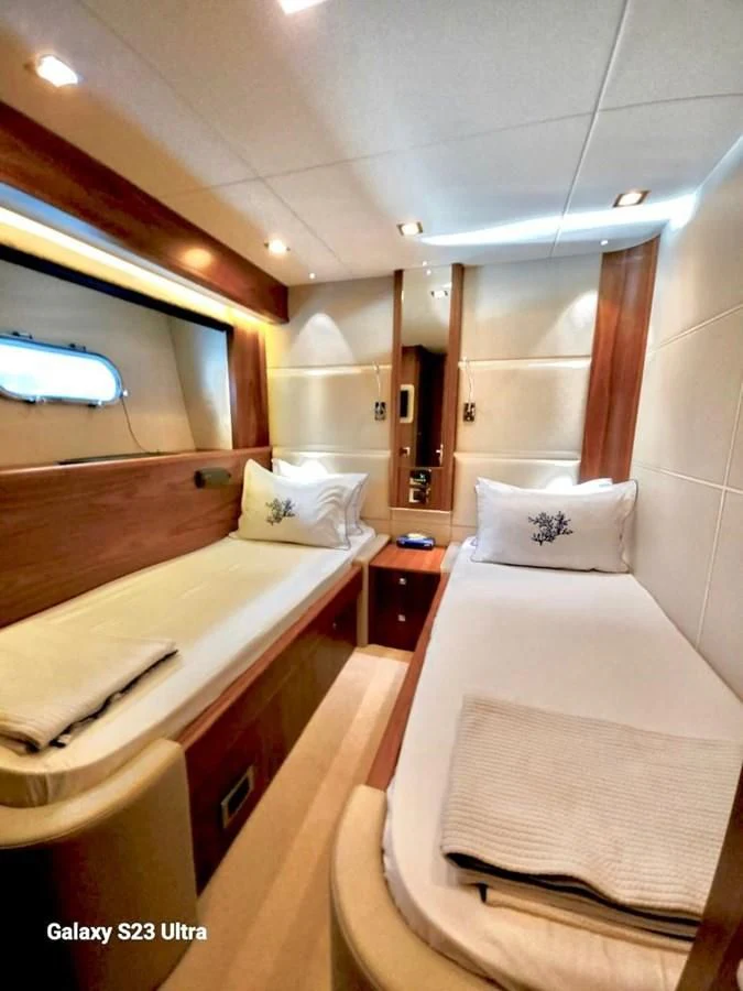a room with a bed and a mirror aboard FAMILY SPIRIT Yacht for Sale