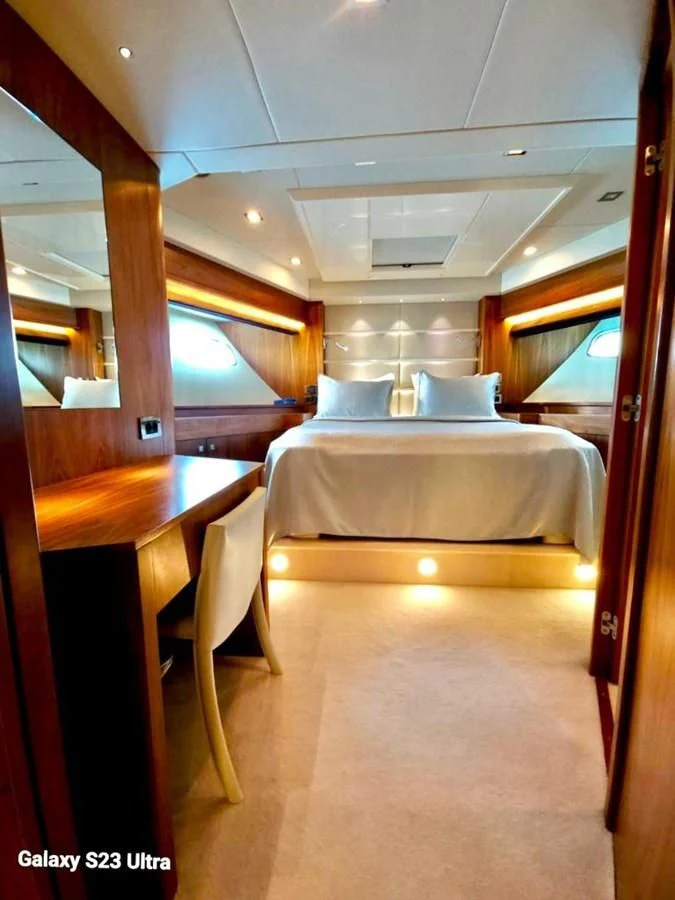 a room with a bed and a table aboard FAMILY SPIRIT Yacht for Sale
