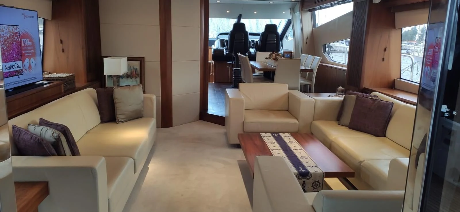 a living room with a couch and a tv aboard FAMILY SPIRIT Yacht for Sale