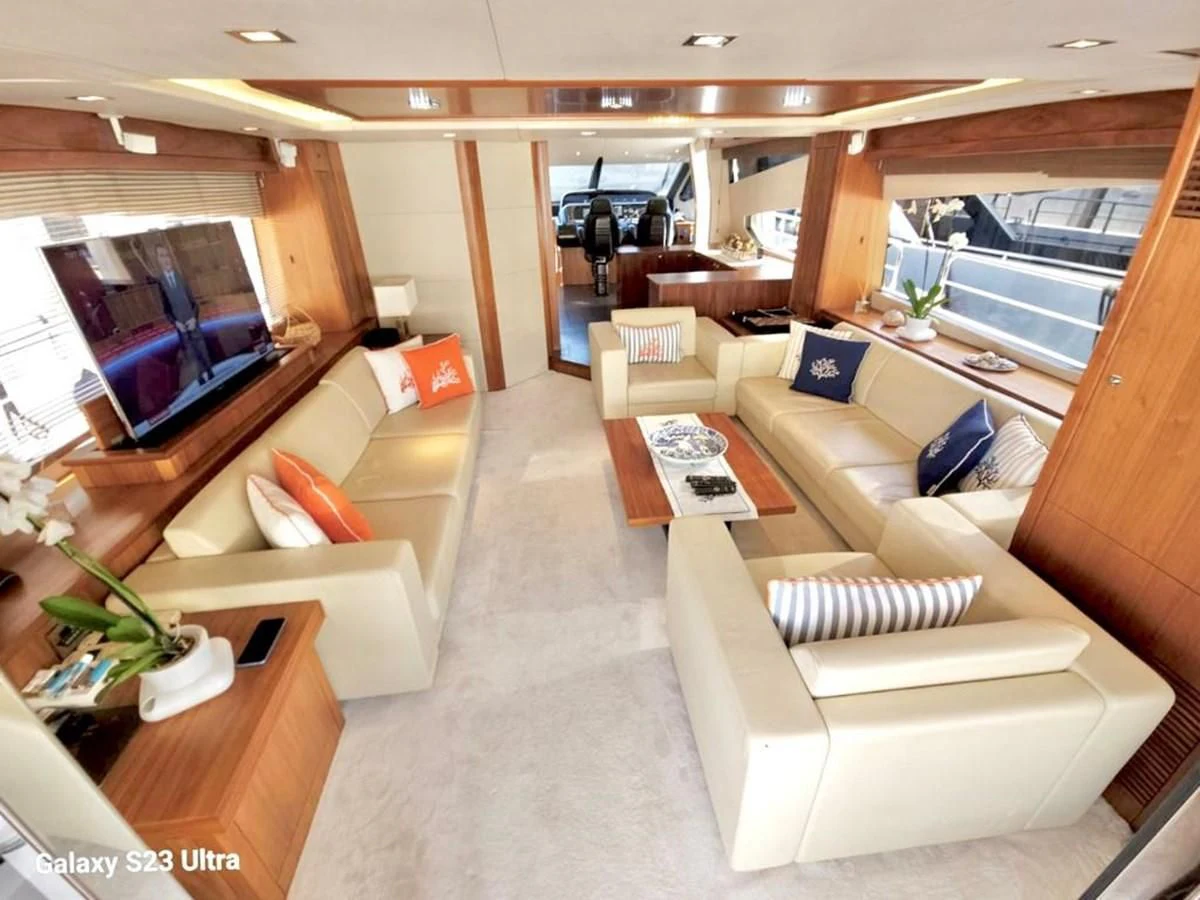 a room with couches and a table aboard FAMILY SPIRIT Yacht for Sale