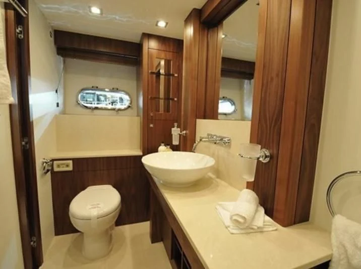 a bathroom with a sink toilet and a bathtub aboard FAMILY SPIRIT Yacht for Sale