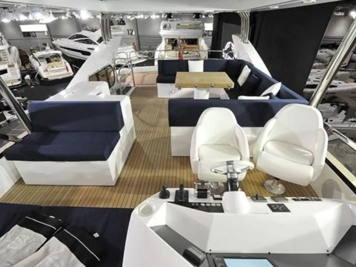 a room with several white chairs aboard FAMILY SPIRIT Yacht for Sale