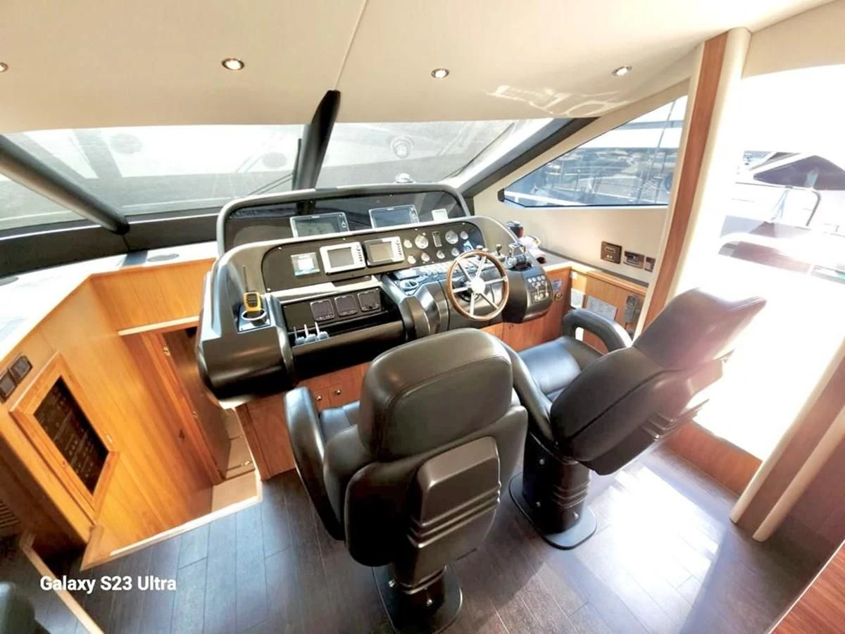 a room with a desk and chairs aboard FAMILY SPIRIT Yacht for Sale