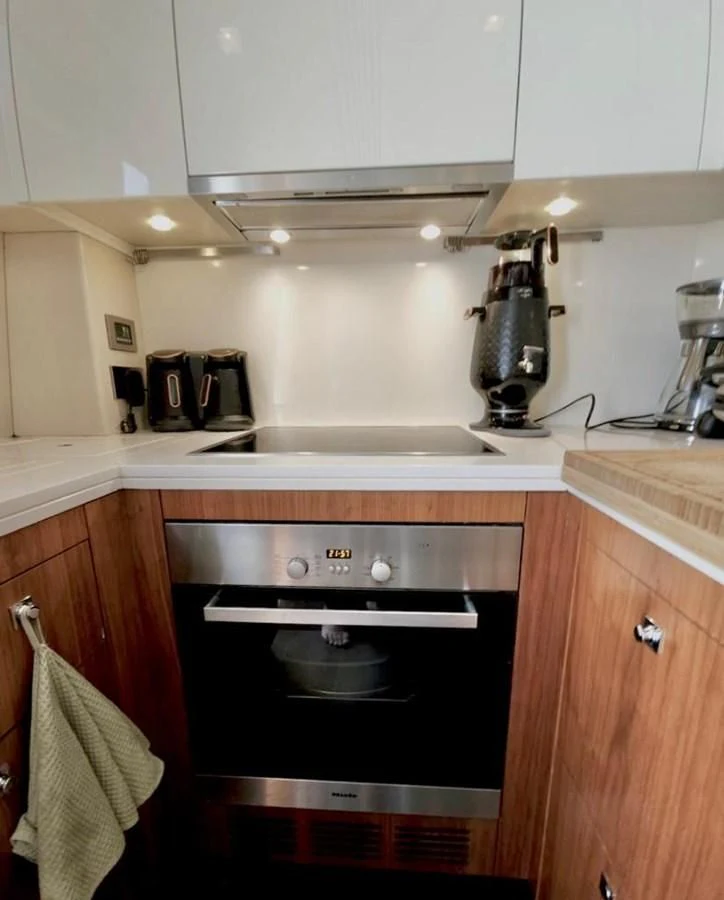 a kitchen with a stove and cabinets aboard FAMILY SPIRIT Yacht for Sale