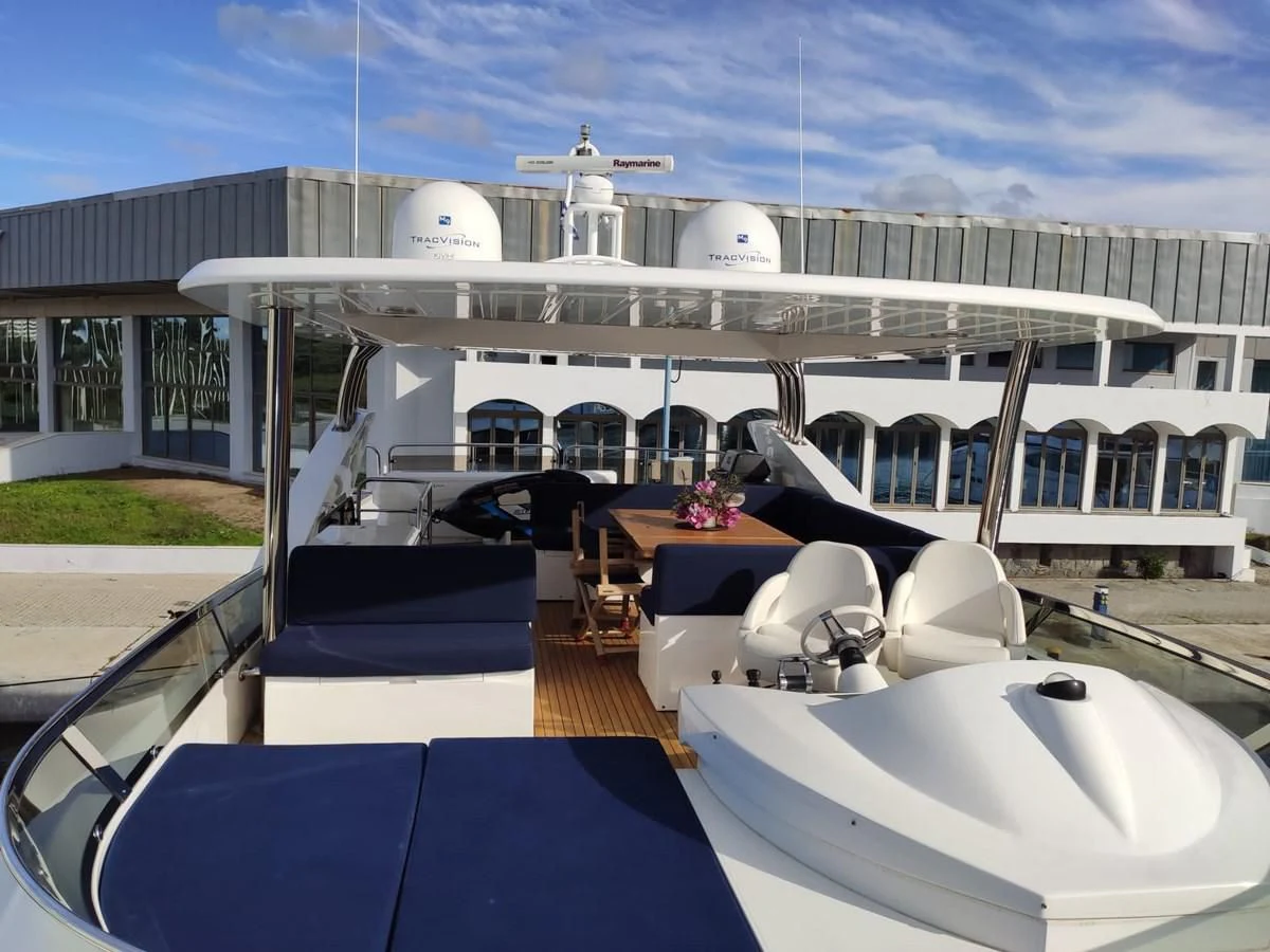 a deck with a pool and a building in the background aboard FAMILY SPIRIT Yacht for Sale