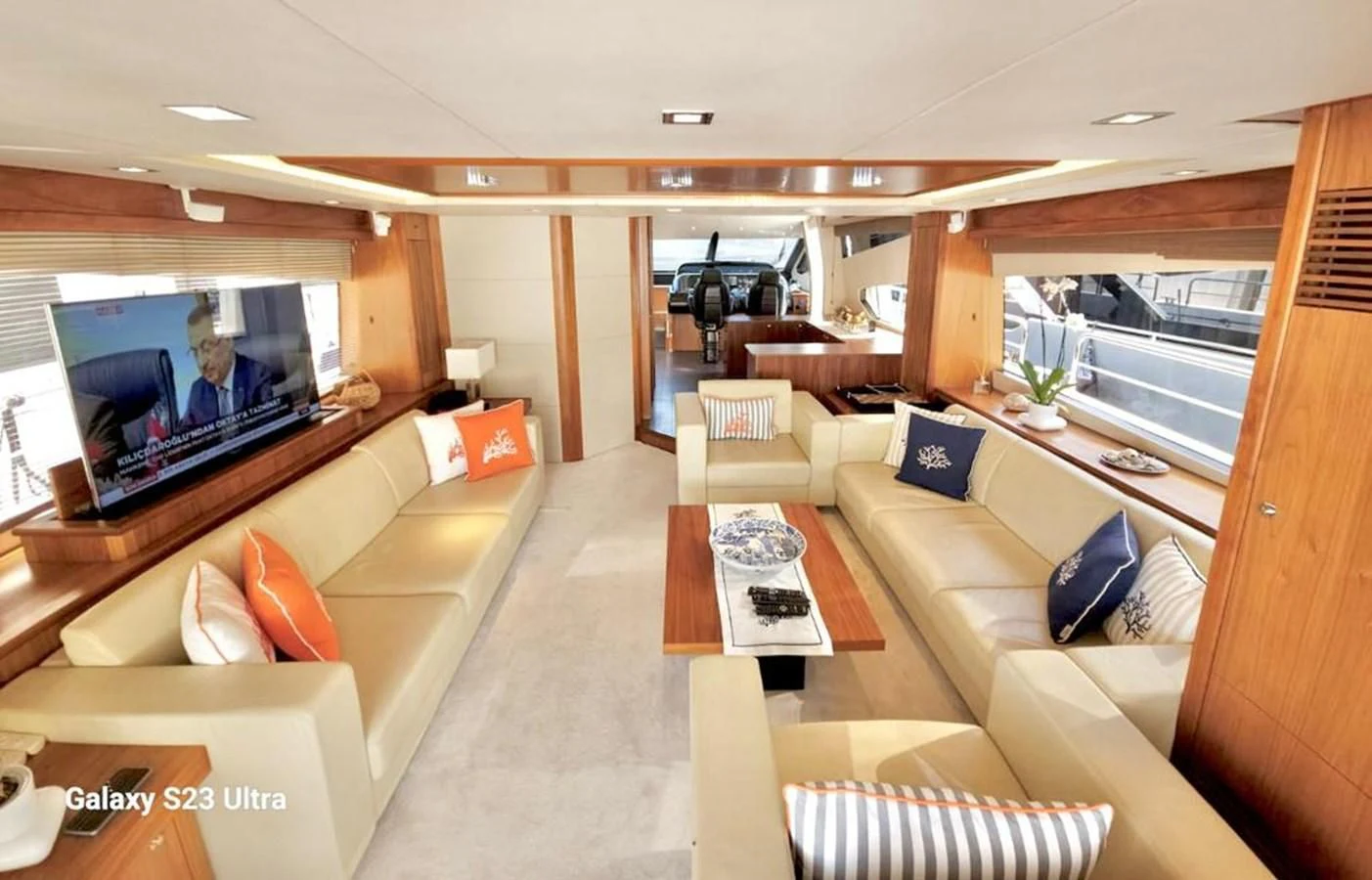 a living room with a large screen aboard FAMILY SPIRIT Yacht for Sale