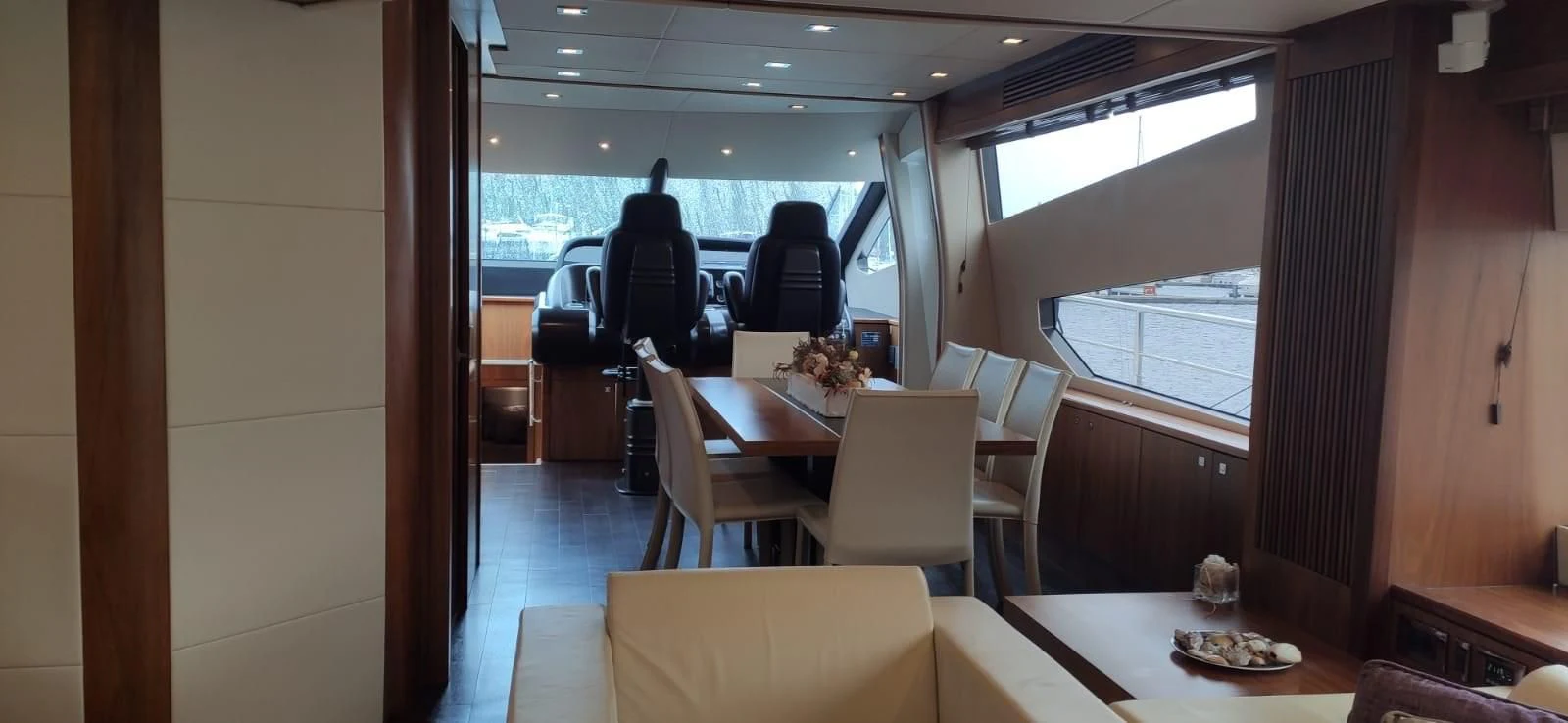 a room with a table and chairs aboard FAMILY SPIRIT Yacht for Sale