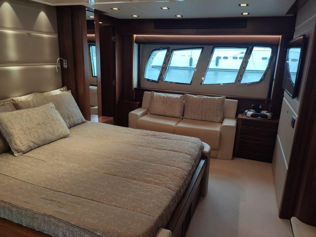 a room with a bed and a couch aboard FAMILY SPIRIT Yacht for Sale
