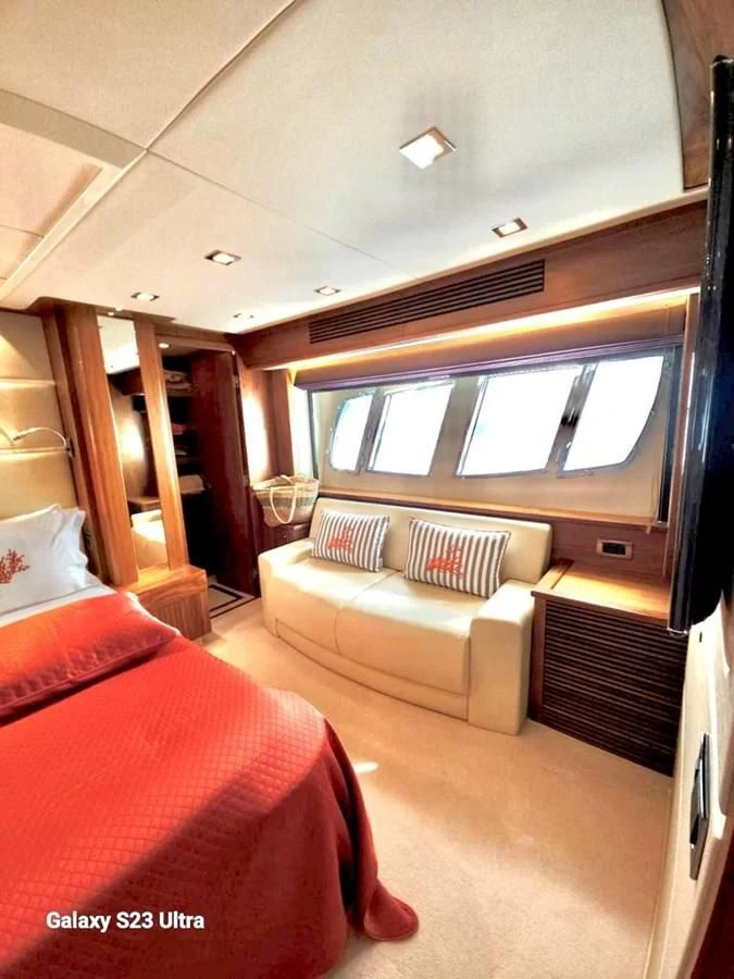 a room with a bed and a couch aboard FAMILY SPIRIT Yacht for Sale