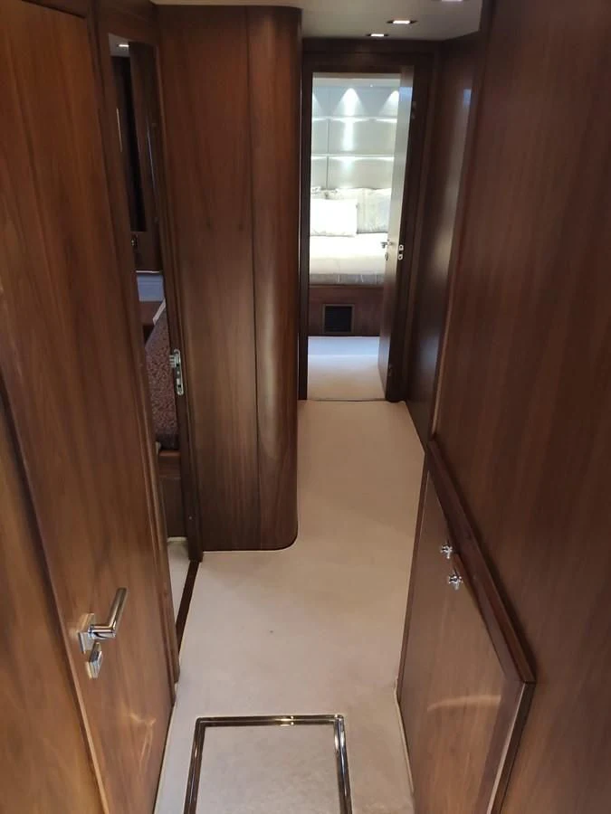a room with a wood door and a window aboard FAMILY SPIRIT Yacht for Sale